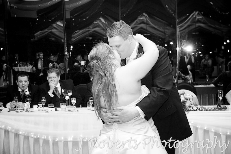 Bride and groom kissing during bridal waltz - wedding photography sydney